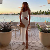 Full body view of the asymmetrical white summer vacation dress.
